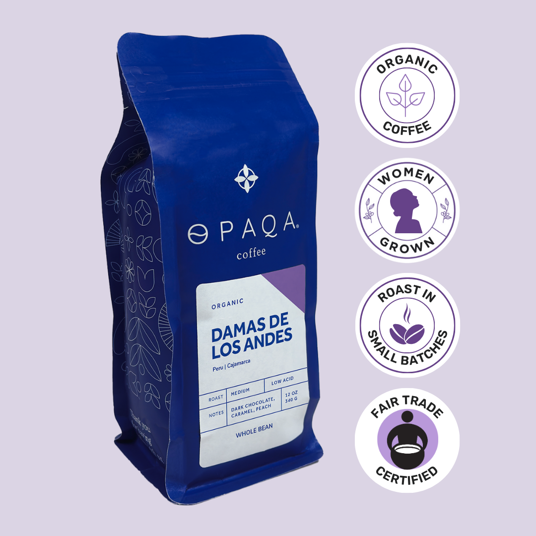 Blue coffee bag with 'Opaqa Coffee' branding and certification logos on a light purple background
