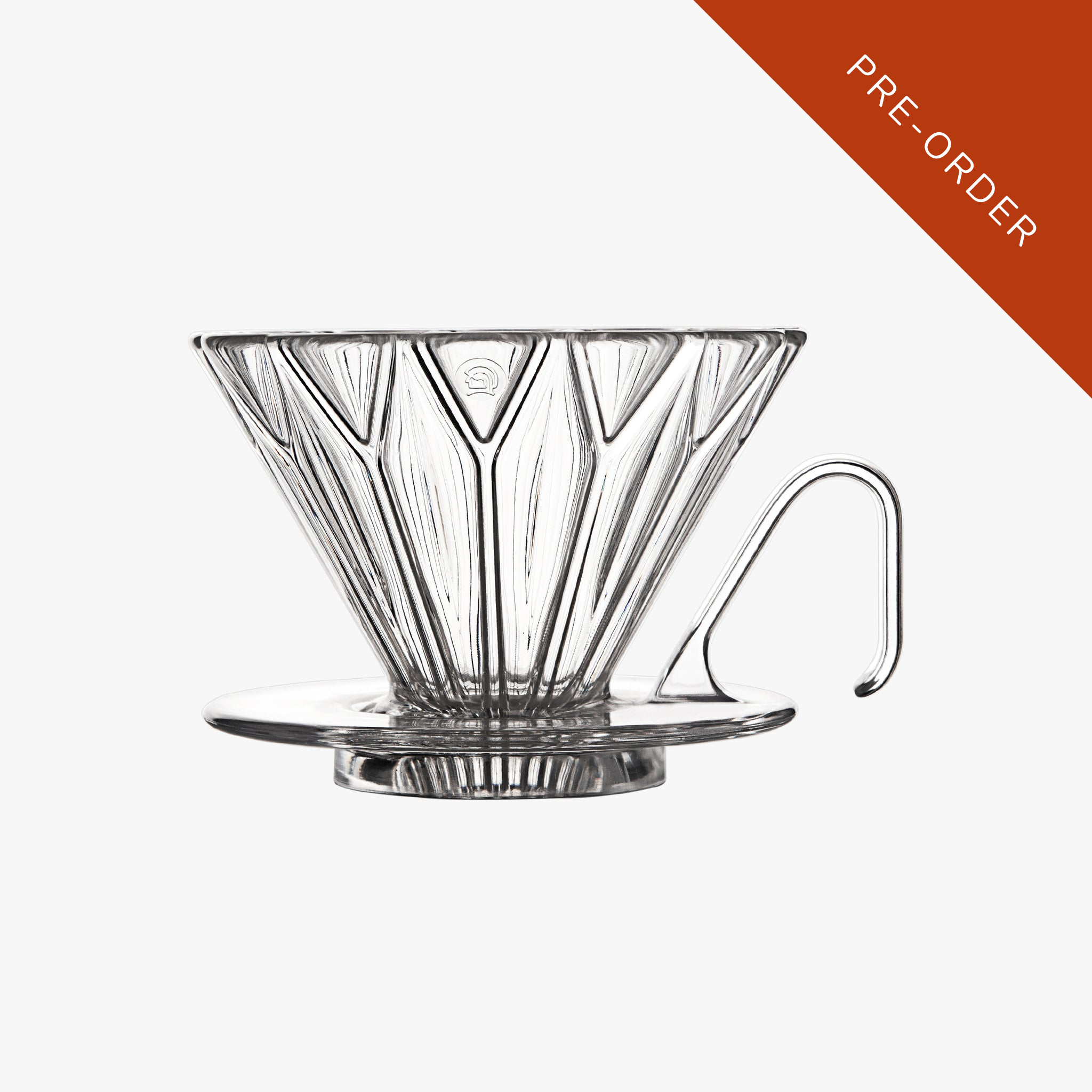 Clear glass coffee dripper on a white background with a brown triangle and 'PRE-ORDER' text.