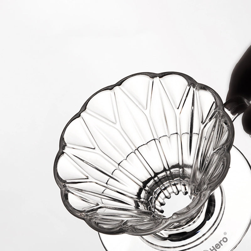 Clear glass coffee filter with a white background