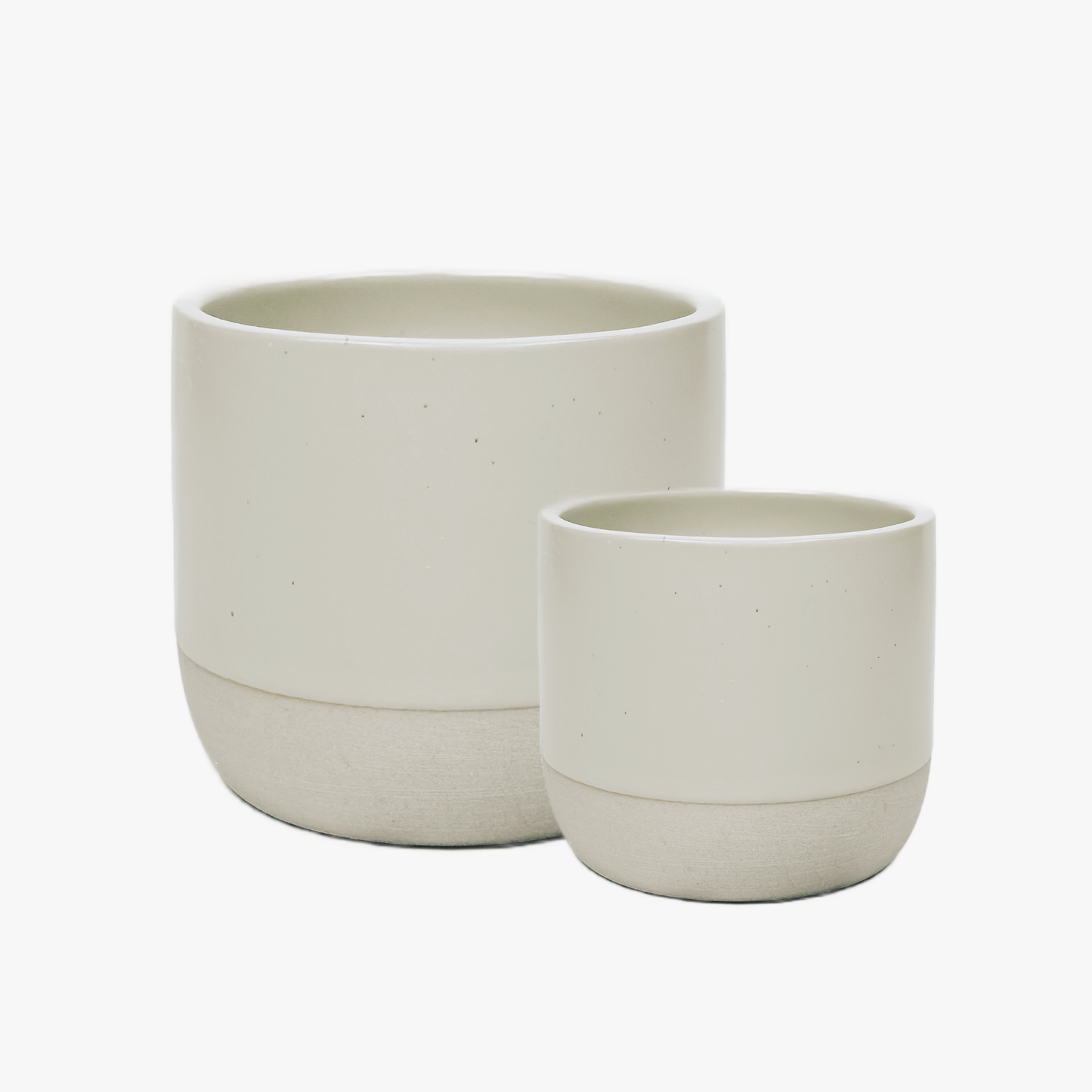 Two beige ceramic planters on a white background